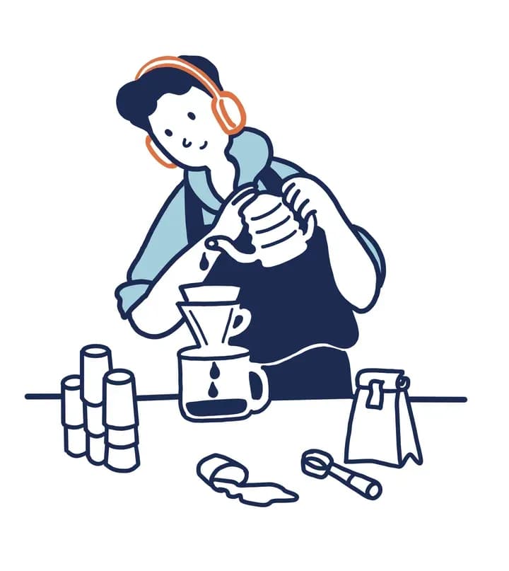 A barista brewing a pour-over coffee at a cafe counter.